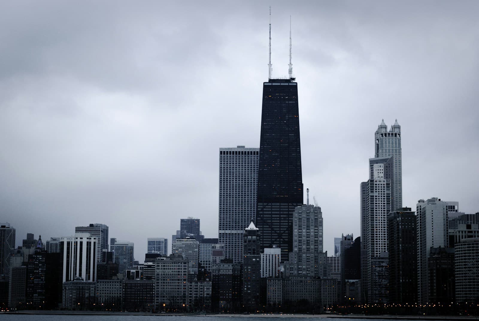 Chicago skyline with Willis Tower under dramatic gray storm clouds